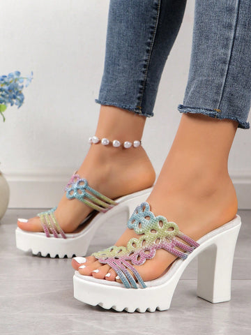 These shimmering rainbow platform flip flops are perfect for making a fashion statement with its high heel design and colorful flower accents. Step into style and comfort with these <a href="https://canaryhouze.com/collections/women-canvas-shoes" target="_blank" rel="noopener">sandals</a>, perfect for any occasion. Elevate your outfit with a touch of rainbow.