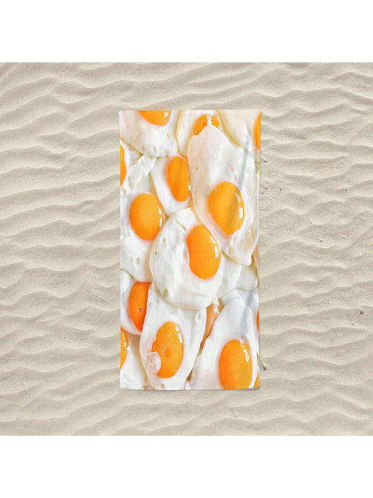 This Sunny Side Up <a href="https://canaryhouze.com/collections/towels" target="_blank" rel="noopener">beach towel</a> features a cartoon fried egg pattern, providing both a fun and functional addition to your beach essentials. Made with the utmost softness and absorbency, it promises to keep you comfortably dry while lounging under the sun.