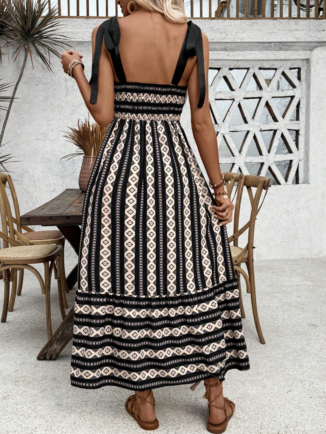 Get ready to turn heads at the beach with our Chic Summer Vibes: Geometric Printed Maxi Dress! Its eye-catching design and flowy silhouette will keep you cool and stylish for all your beach getaways. Don't miss out on this must-have dress for the ultimate summer vibes!
