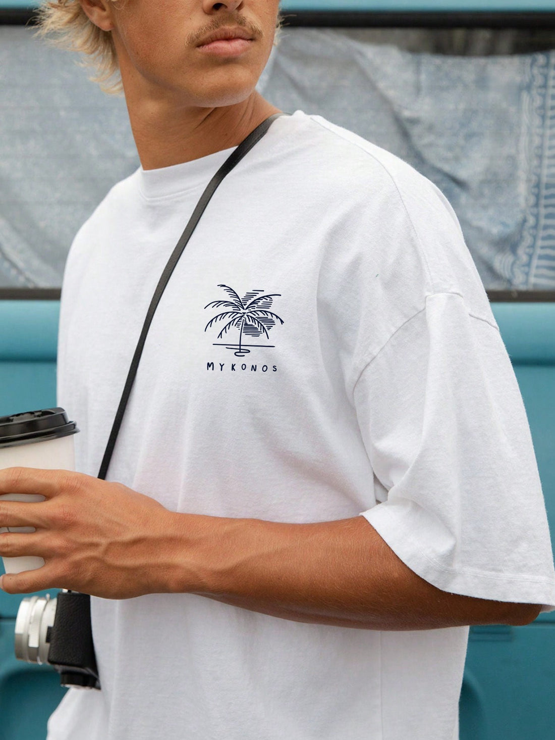 Unwind in the comfort of our Relaxed Vibes: Men's Coconut Tree Graphic Short Sleeve T-Shirt. Made from a soft and breathable cotton blend, this tee features a stylish graphic design of a coconut tree, perfect for adding a touch of laid-back style to your wardrobe. Embrace the relaxed vibes with this must-have t-shirt.
