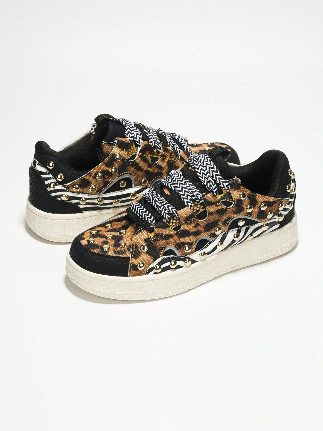 Elevate your fashion game with our Rani Studded Lace-Up <a href="https://canaryhouze.com/collections/women-canvas-shoes" target="_blank" rel="noopener">Sneakers</a>. Step out in style with confidence, thanks to the trendy studded design and lace-up closure. With these sneakers, you'll achieve the perfect blend of comfort and style, making them a must-have for any fashion-forward individual.