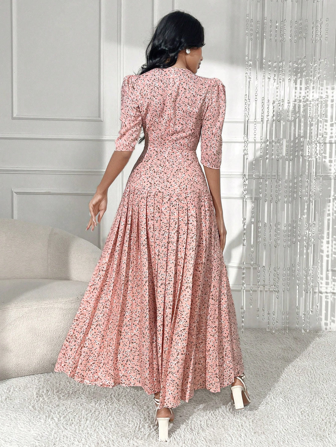 This stylish dress features delicate pleats and charming button details, making it the perfect choice for any occasion. With its elegant floral design, it will add a touch of sophistication and glamour to your wardrobe. Made with high-quality materials, it offers both comfort and style, making it a must-have for any fashion-forward individual. Elevate your look with this chic and versatile dress.