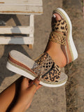 Elevate your style with these ultra-light and stylish women's woven platform wedge sandals. The beautiful leopard print detail adds a touch of fun to these comfortable and trendy sandals. Perfect for any occasion, these sandals are a must-have for any fashion-forward woman.