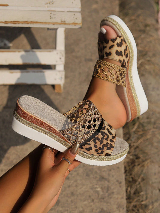 Elevate your style with these ultra-light and stylish women's woven platform wedge sandals. The beautiful leopard print detail adds a touch of fun to these comfortable and trendy sandals. Perfect for any occasion, these sandals are a must-have for any fashion-forward woman.