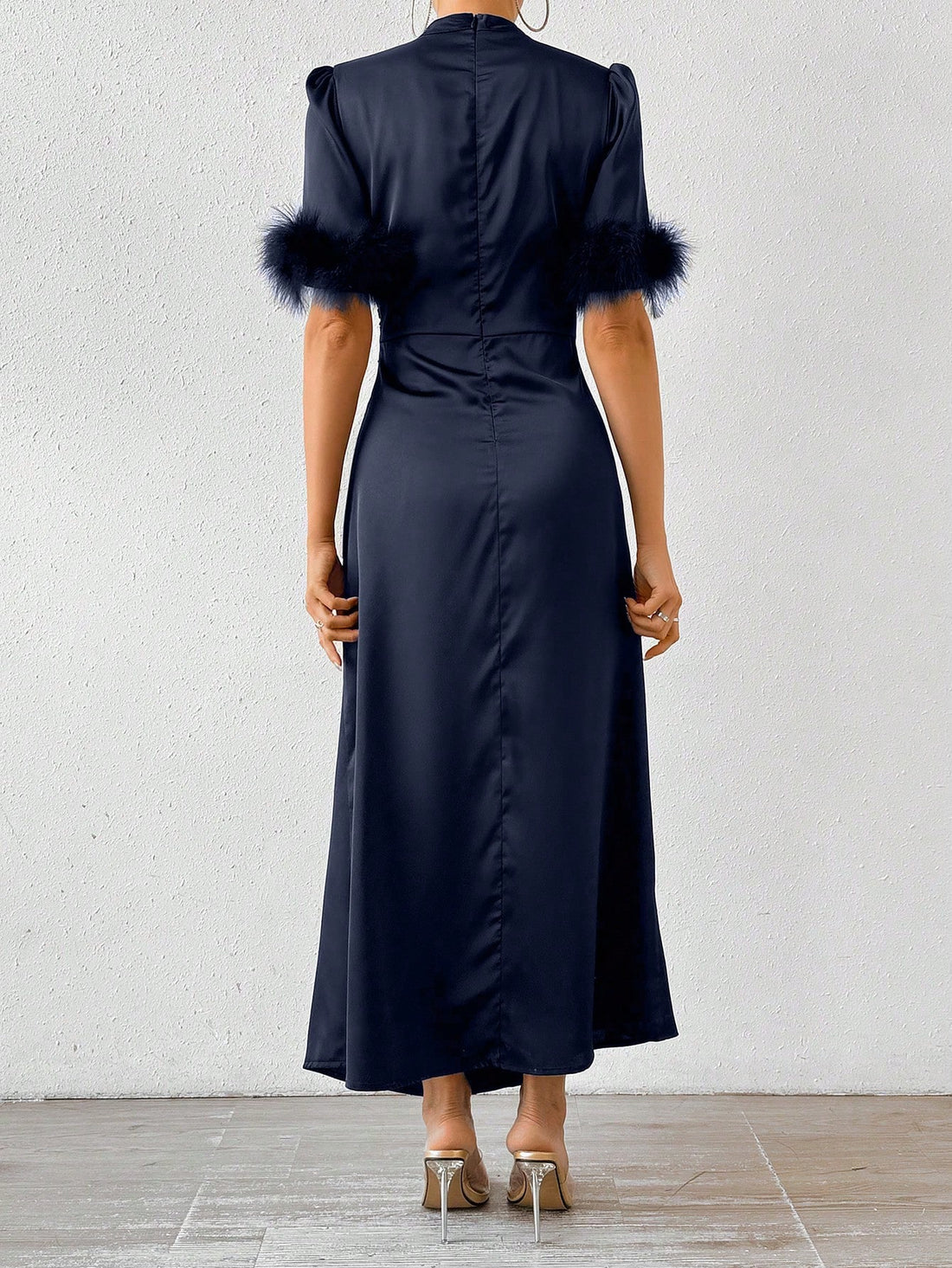 Experience the luxurious and stylish Feathered Elegance dress. Crafted with high-quality turkey feathers and satin, this dress is the epitome of elegance. Perfect for any special occasion, the soft feather detailing adds a touch of glamour and sophistication. Elevate your style with Feathered Elegance.