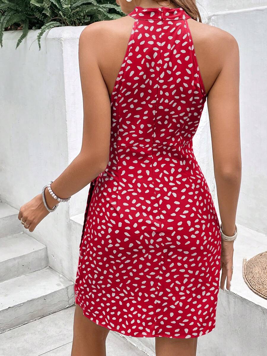 Back view of coral wrap-style mini dress with halter neckline