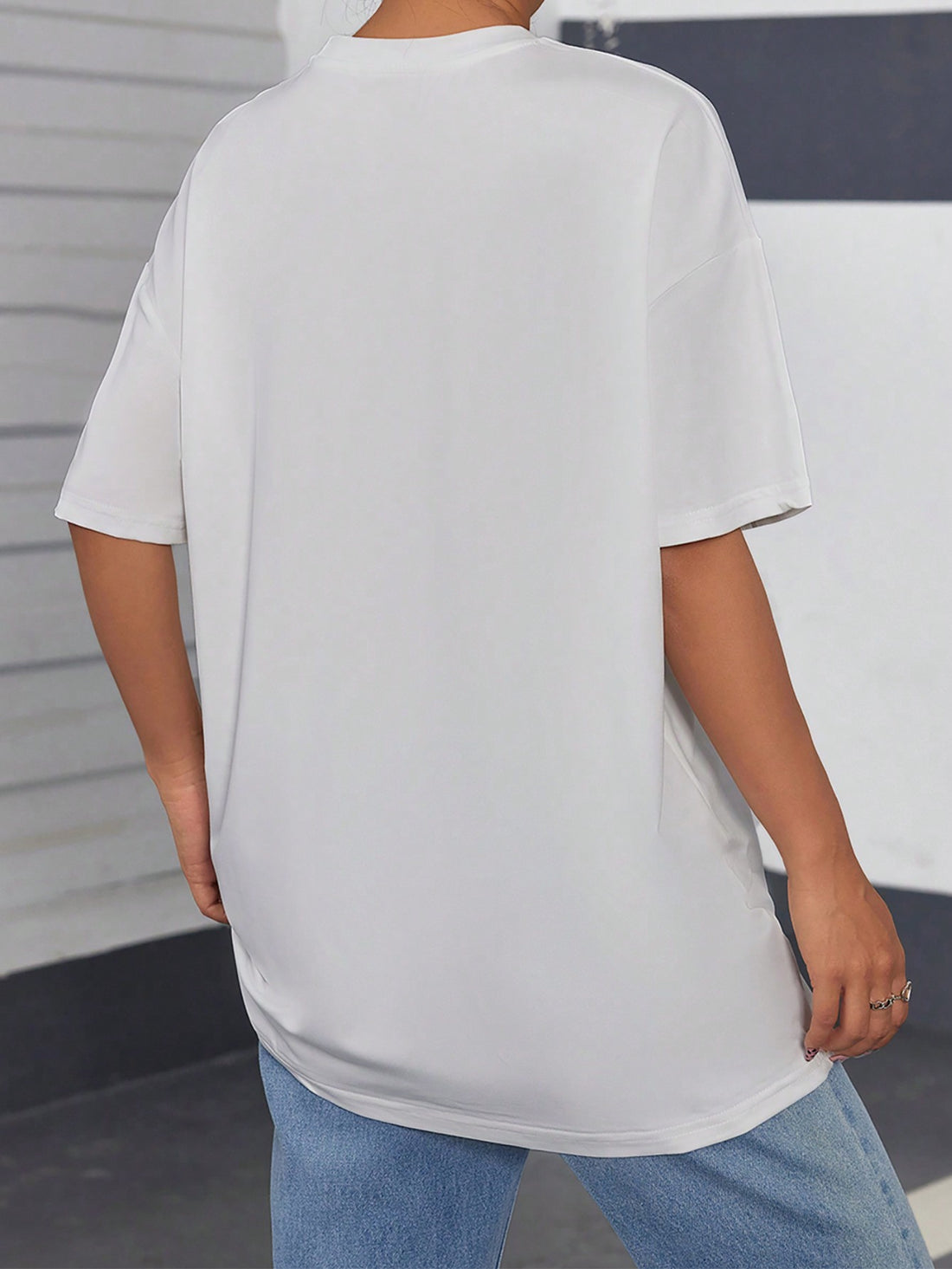 Unleash your inner cat lover with our Whimsical Cat Vibes Drop Shoulder T-Shirt. Made with a comfortable and stylish drop shoulder design, this t-shirt is perfect for any feline enthusiast. Show off your love for cats with this fun and unique shirt.