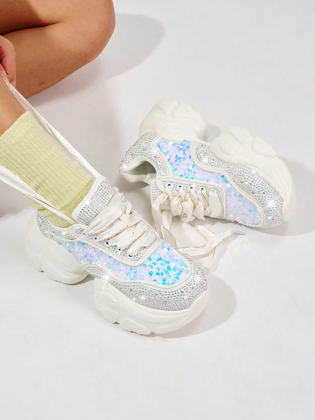 Upgrade your party and dance look with Sparkle and Shine's Rhinestone Charming Sneakers. These stunning shoes feature shimmering rhinestones for an eye-catching sparkle. Perfect for any special occasion, these sneakers will keep you comfortable and stylish all night long.