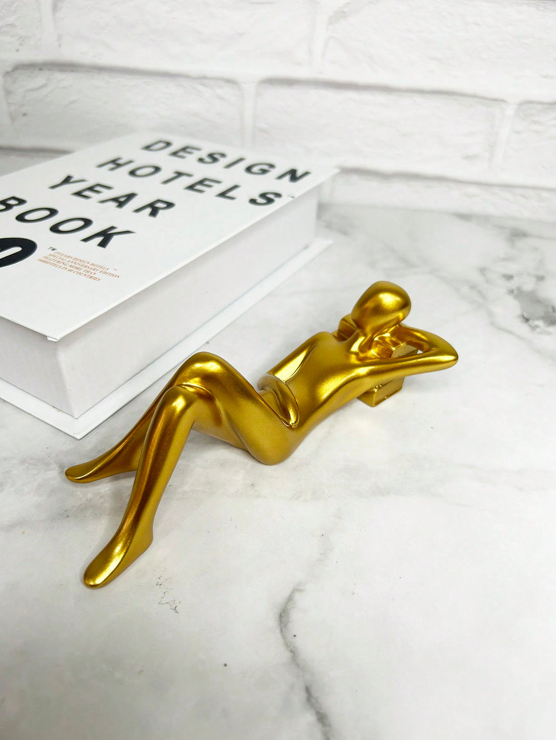 This Abstract Book Reading Home Decor <a href="https://canaryhouze.com/collections/ornaments" target="_blank" rel="noopener">Ornament</a> is a resin art piece that adds a unique and artistic touch to any home. Its abstract design evokes a sense of creativity and imagination, making it a perfect addition to any room. Made with high-quality resin, it is durable and long-lasting. Transform your living space into an art gallery with this beautiful home decor ornament.