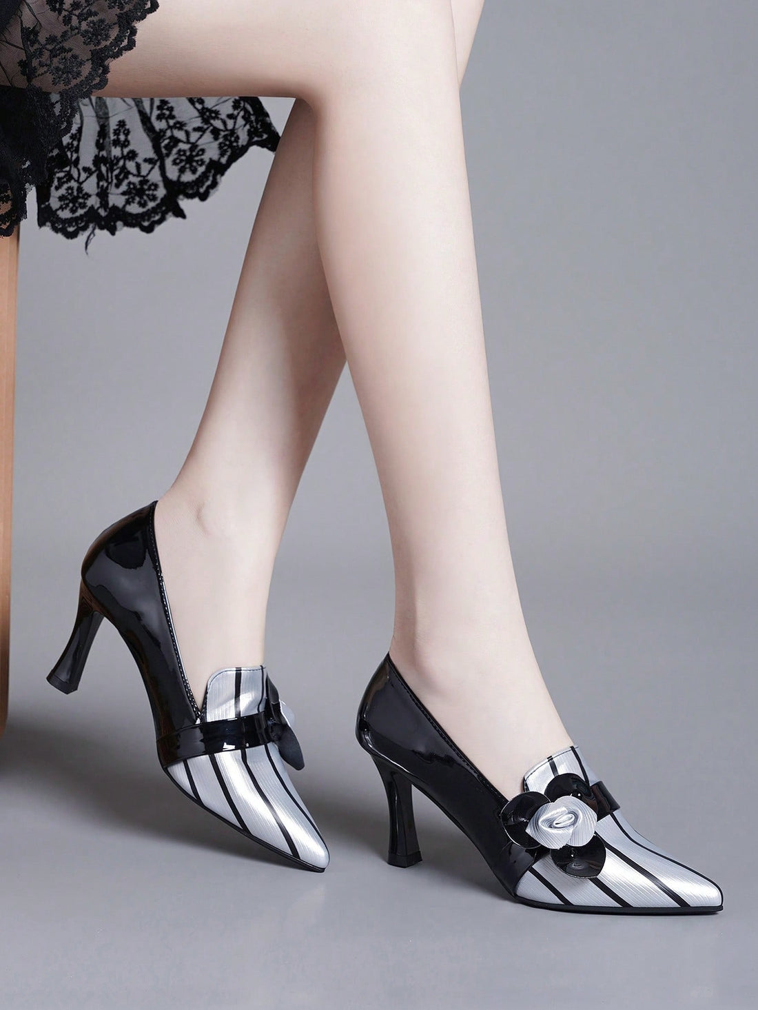 Elevate your style with our Colorblock Luxe: Buckled High Heel Pumps. These stylish pumps feature a colorblock design and buckled detailing, making them the perfect addition to your wardrobe. With a high heel, you'll add height to your look and stand out from the crowd. Perfect for any fashion-forward woman.