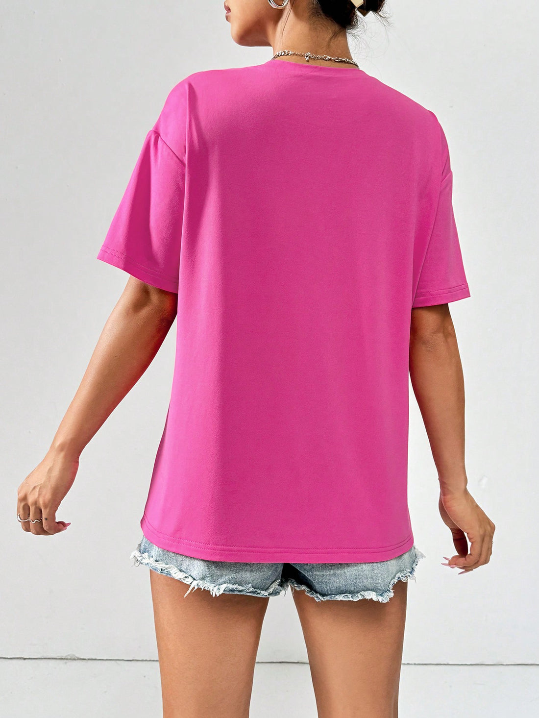 Rock your casual style with this IN MY MOM ERA graphic tee. Its loose-fit design makes it perfect for a laid-back summer look. Effortlessly stylish, this tee is a must-have for any wardrobe. Show off your unique personality with this fun and quirky shirt. (Go ahead, make your mom proud!)