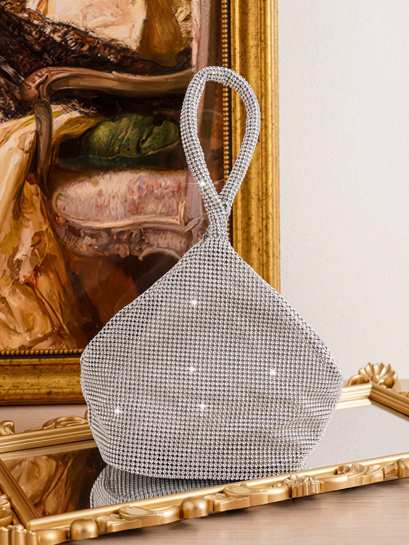 This Geometric Glamour Mini Diamond Evening Bag is the perfect accessory for any party. With its stunning geometric design and sparkling diamond embellishments, it is sure to make a statement. The compact size allows for easy carrying of all your party essentials. Elevate your style and make a lasting impression with this glamorous evening bag.