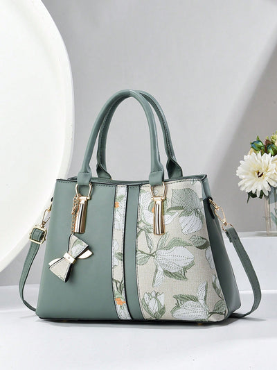 Invest in this chic and stylish crossbody <a href="https://canaryhouze.com/collections/canvas-tote-bags?sort_by=created-descending" target="_blank" rel="noopener">bag</a> for a practical yet fashionable accessory. With its large capacity and three layers of pockets, you'll have plenty of space for your everyday essentials. The eye-catching print adds a touch of personality to any outfit. Don't compromise style for function with this must-have bag.