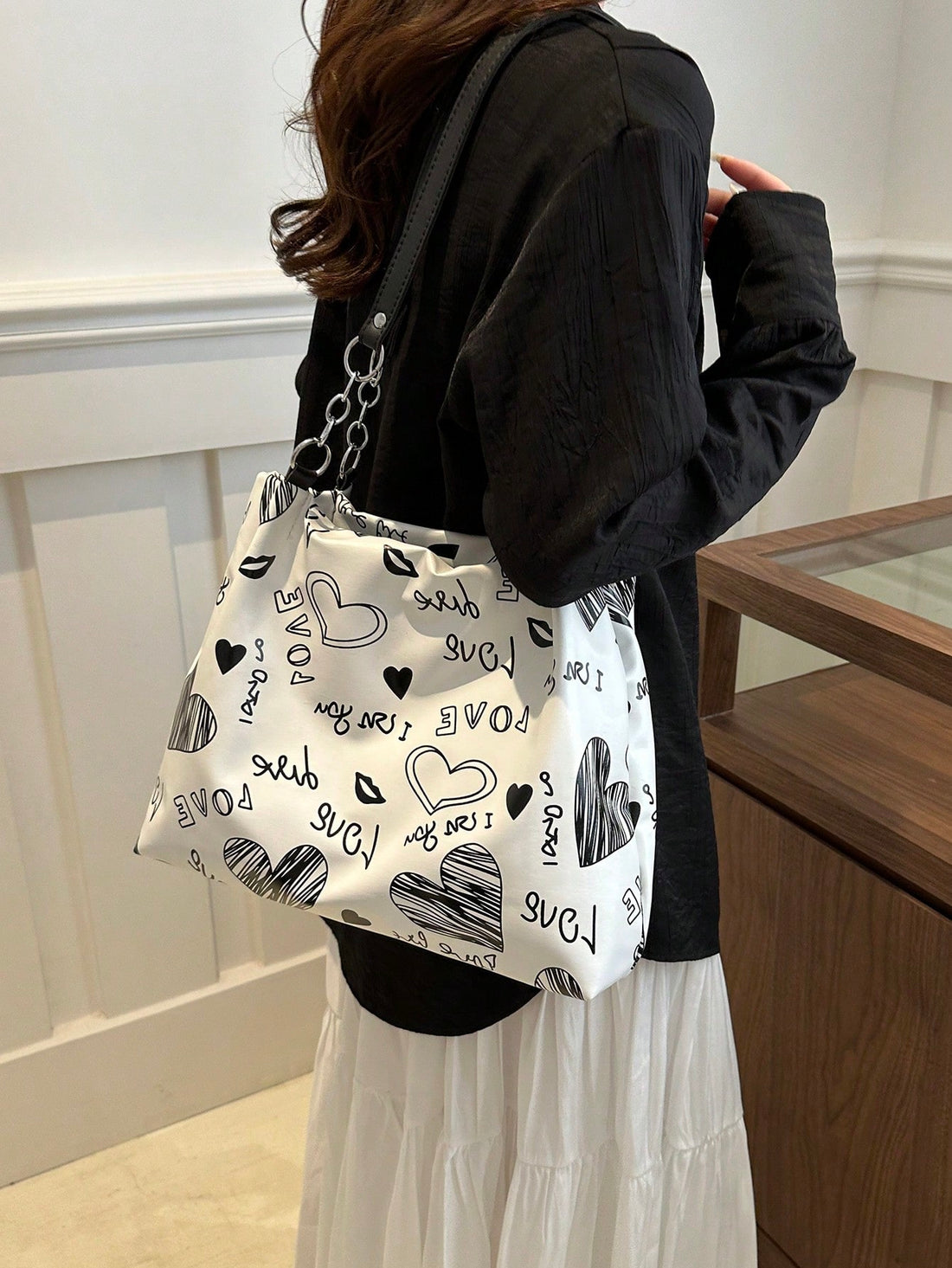 As an industry expert, I highly recommend our Classy Chain Decor Shoulder Bag. This elegant bag is perfect for teachers and travel enthusiasts, featuring a stylish chain decor and practical shoulder strap. With its functional design and classy look, it makes for the perfect gift. Don't miss out on this must-have accessory.