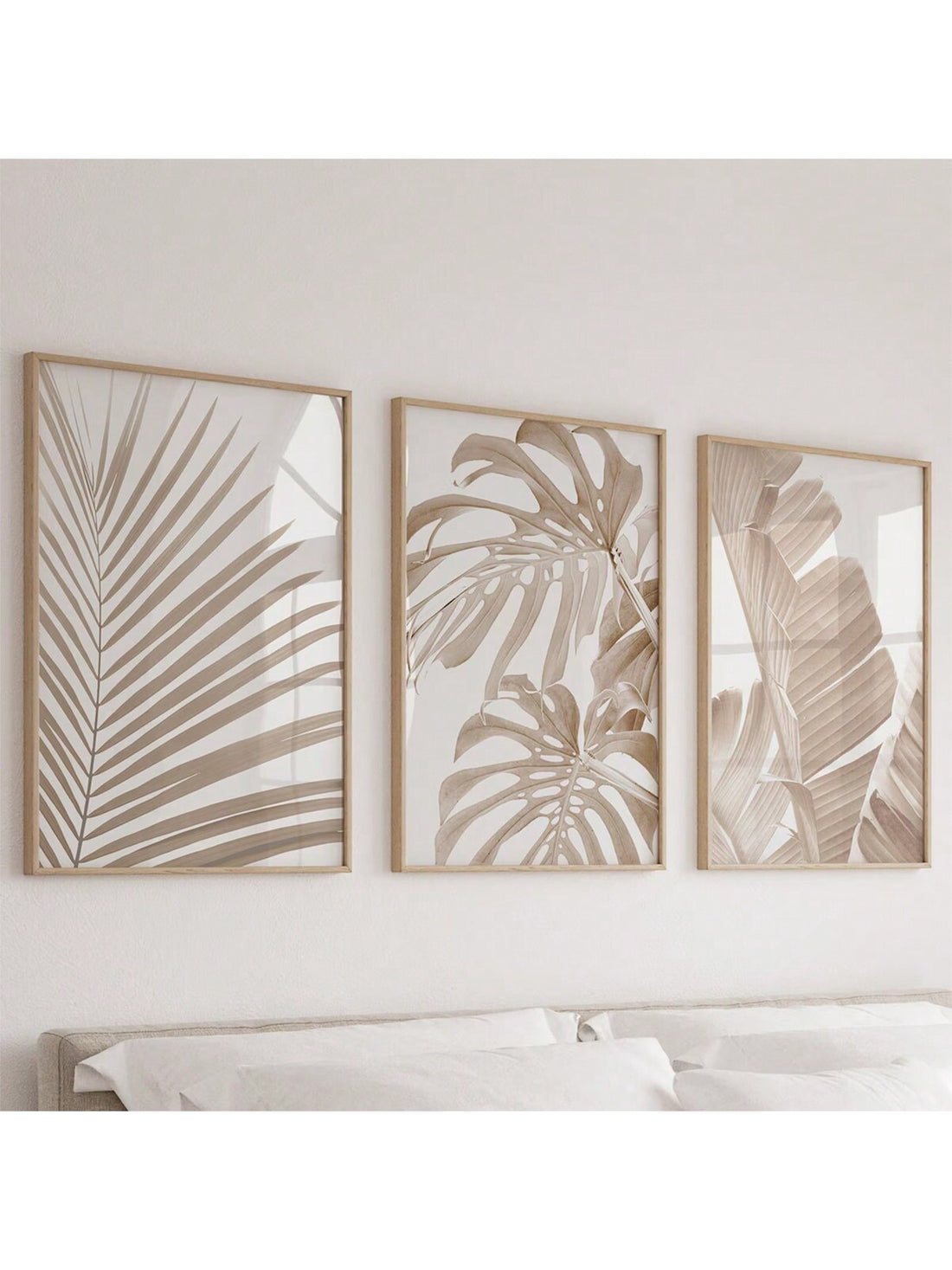 Bring a fresh vibe to any room with this Modern 3-Piece Tropical Leaf Wall Art Set. Perfectly unframed and printable, these playful prints add a breath of tropical calm to your minimalist space. Easy to mix, match, and hang your way to a breezy, lively atmosphere!