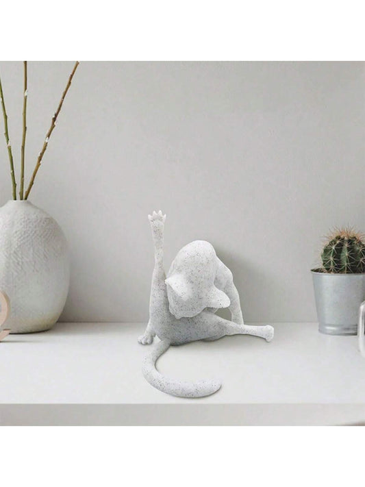 Add a touch of whimsy to your <a href="https://canaryhouze.com/collections/ornaments" target="_blank" rel="noopener">home decor</a> with our charming Whimsical White Cat Figurine. Crafted from durable resin, this playful ornament makes for a perfect gift for any cat lover. Its intricate design and high-quality materials make it a stylish and lasting addition to any collection.
