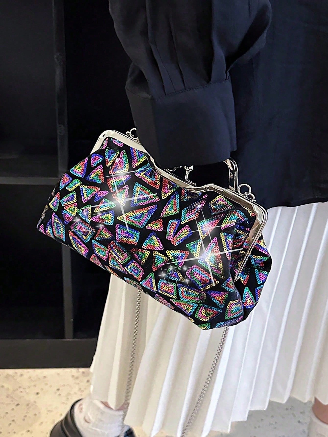 Elevate your evening ensemble with the Shimmering Nights: Square-Shaped Sequined Evening Clutch Bag. The sleek square-shaped design and sparkling sequins will add a touch of glamour to any outfit. With its compact size and secure closure, you can confidently carry your essentials for a night out.