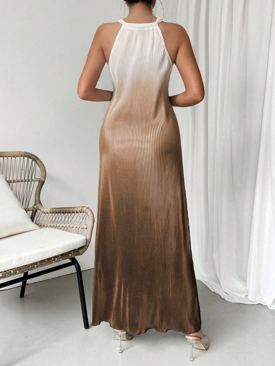 Get ready to turn heads with our Chic Ombre Sleeveless Halter Neck Long Dress! Perfect for spring and summer, this dress exudes elegance and style. The unique ombre design adds a touch of flair, while the halter neck keeps you cool and comfortable. Elevate your wardrobe with this must-have dress.