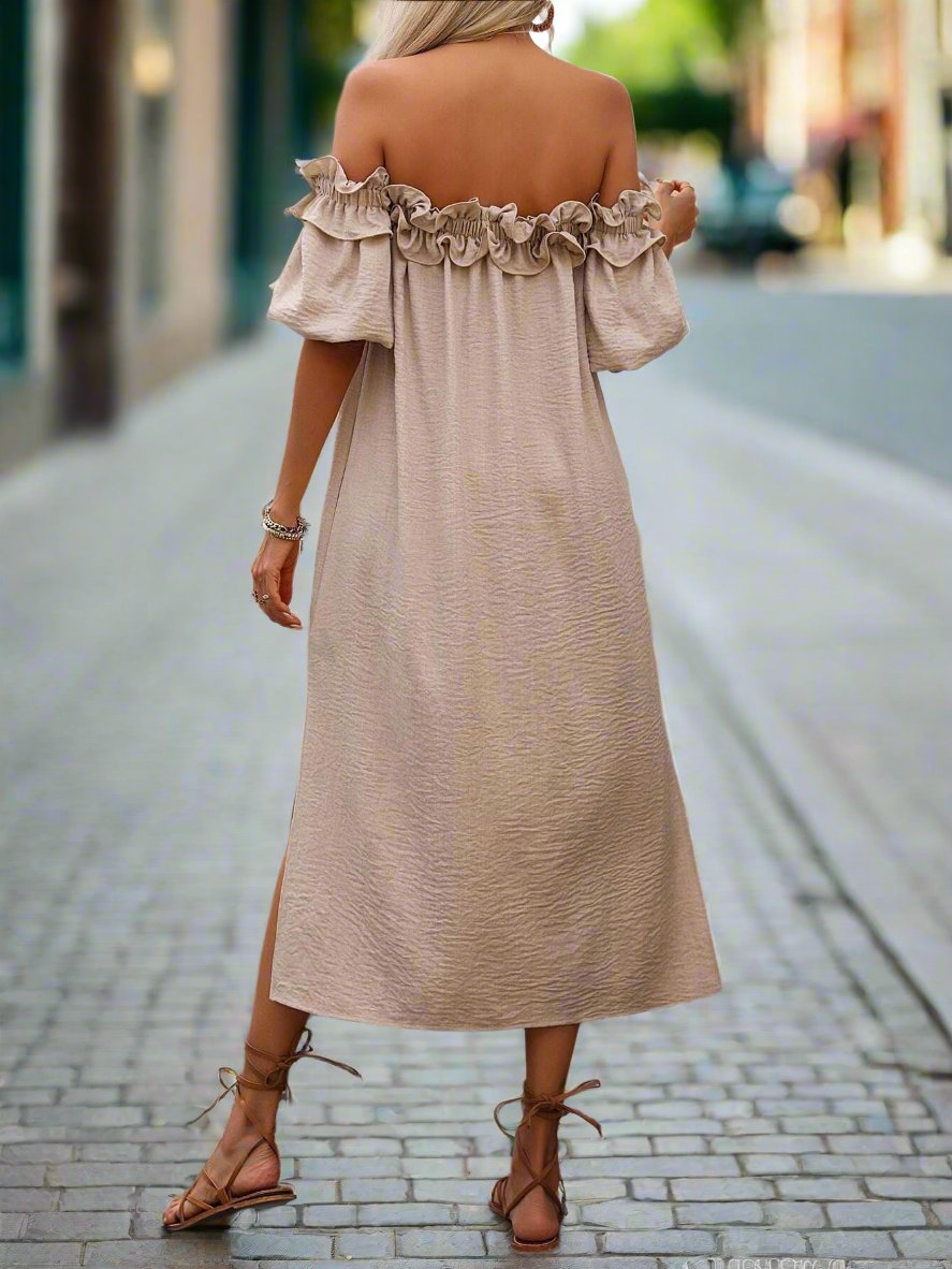 Stay stylish and protected from the sun with our Off-Shoulder Ruffle Trim Slit Dress. The off-shoulder design and ruffle trim add a fashionable touch, while the slit provides added comfort and breathability. Perfect for any sunny day, this dress will keep you looking and feeling your best.
