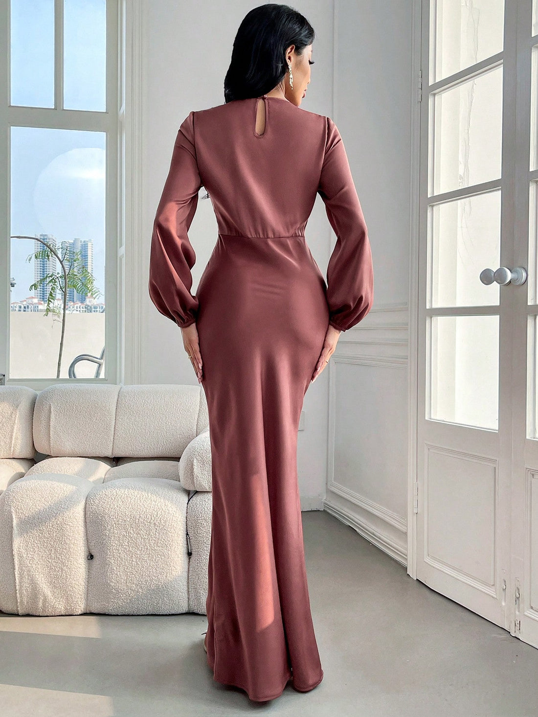 The Elegantly Classic dress features a timeless design with solid bishop sleeves and a mermaid hem, creating a flattering silhouette. Crafted with high-quality materials, this dress exudes sophistication and elegance. Perfect for any formal occasion, it's a must-have for every wardrobe.