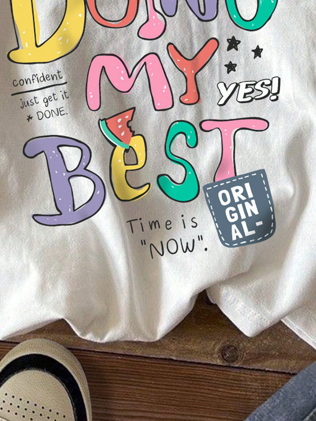 Introducing the Vibrant English Graphic Tee - a trendy, must-have addition to your wardrobe. This casual cotton blend round neck t-shirt for women showcases a vibrant graphic design that is perfect for making a stylish statement. Made with high-quality materials, this tee offers comfort and style in one.