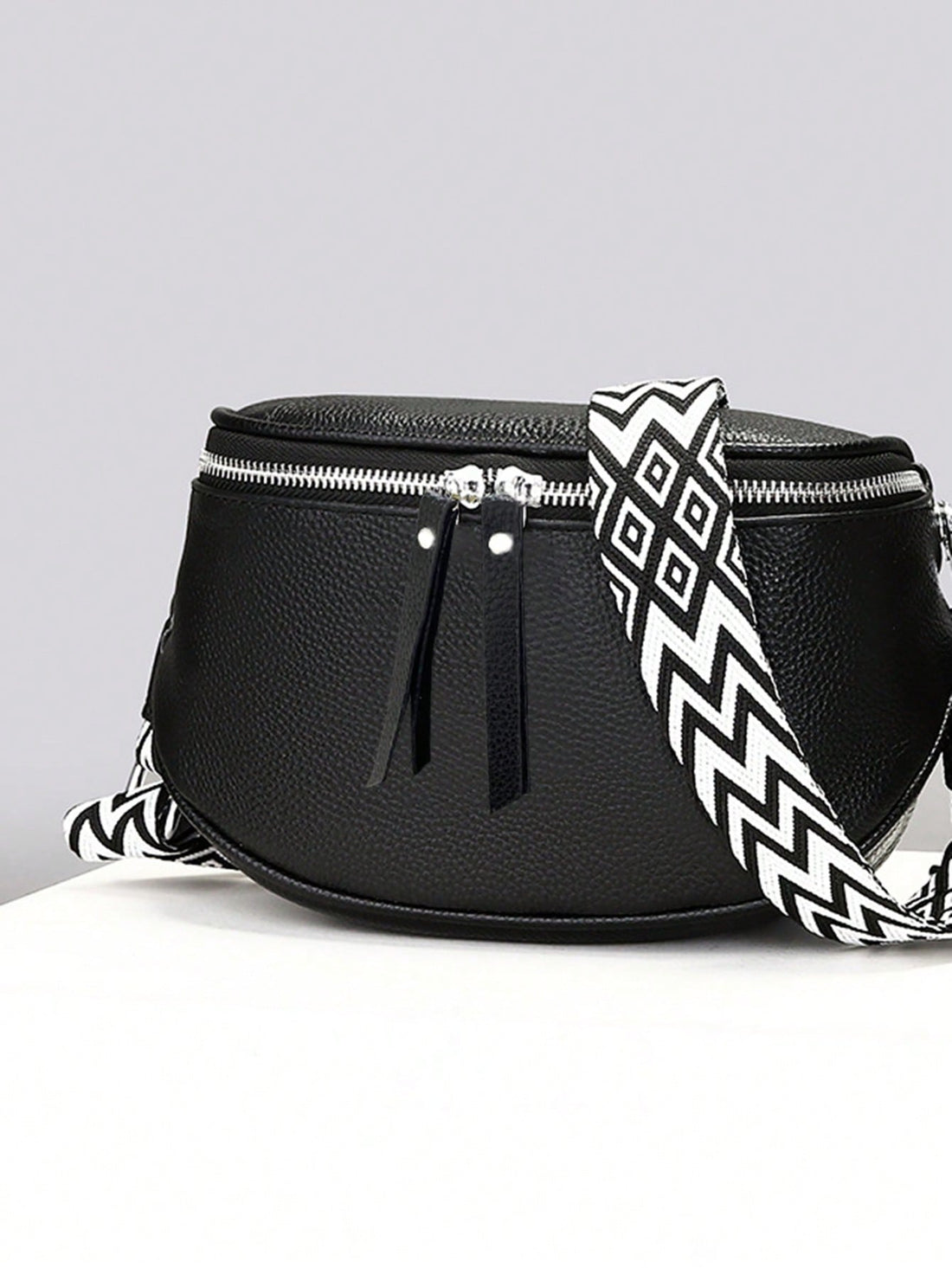 Introducing the Expandable Elegance: Large Capacity Bucket Crossbody Bag. This stylish bag provides ample space for all your essentials. Its expandable design allows for even more storage, making it perfect for those on-the-go. Stay organized and stylish with this must-have accessory.