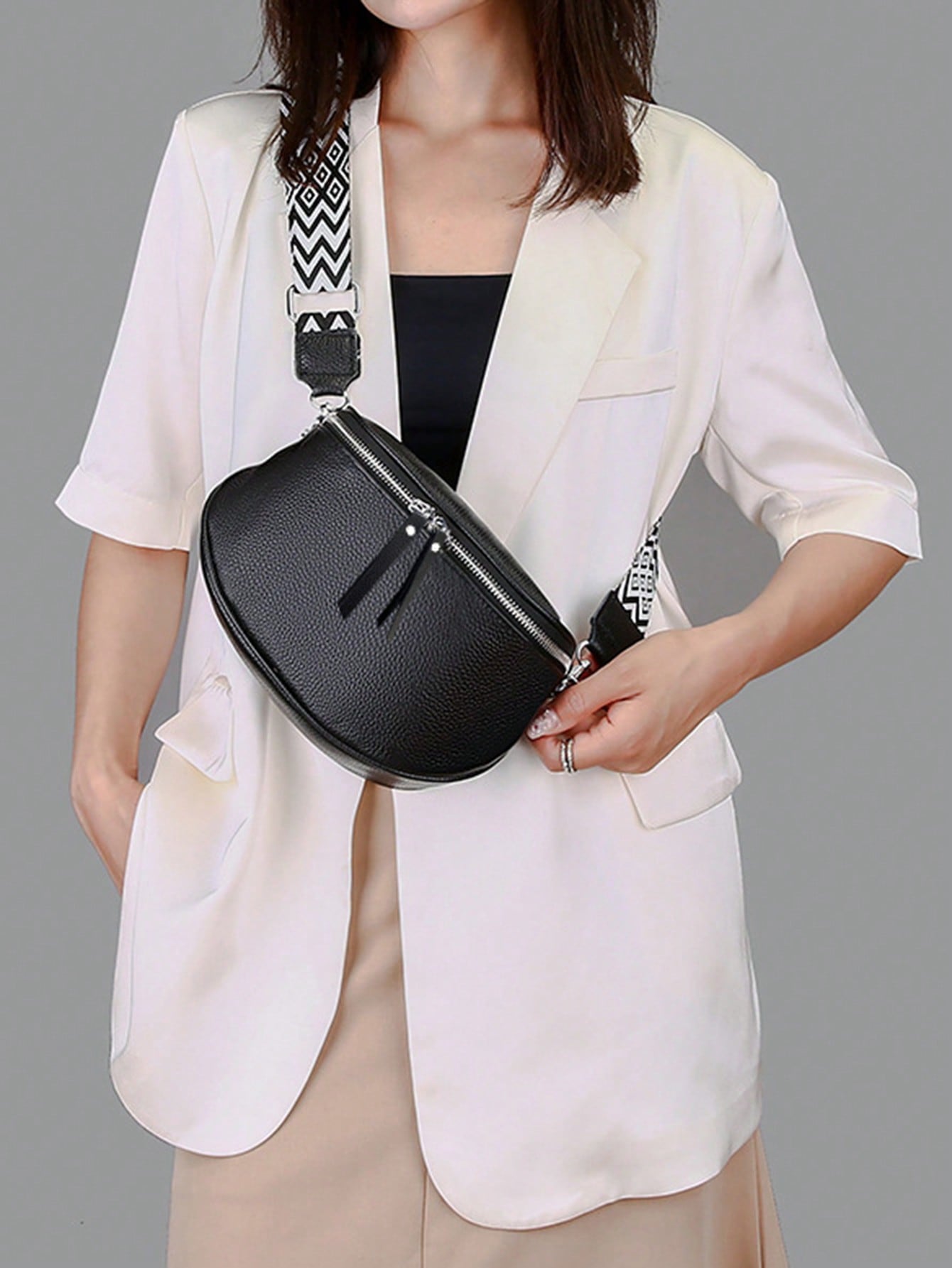 Introducing the Expandable Elegance: Large Capacity Bucket Crossbody Bag. This stylish bag provides ample space for all your essentials. Its expandable design allows for even more storage, making it perfect for those on-the-go. Stay organized and stylish with this must-have accessory.