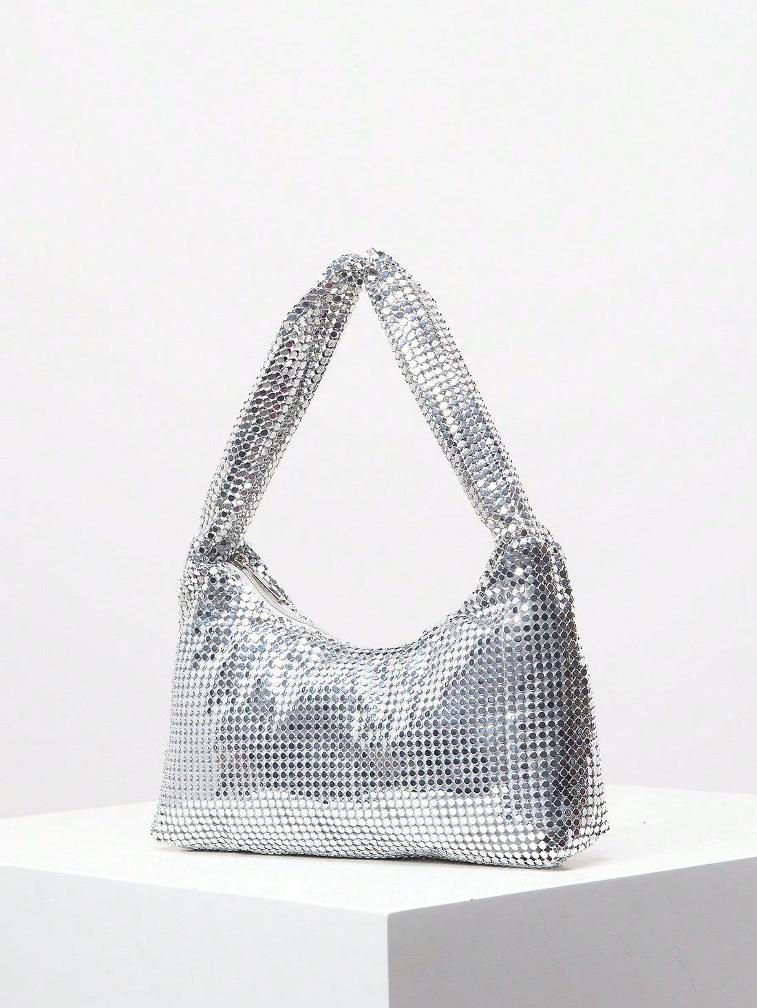 Elevate your formal ensemble with our Shimmering Rhinestone Clutch - the perfect accessory for any evening event. Its sparkling rhinestone design exudes elegance and adds a touch of glamour to your outfit. Its compact size makes it ideal for carrying your essentials, while its sleek design is sure to make a statement. Elevate your style game with this must-have clutch.