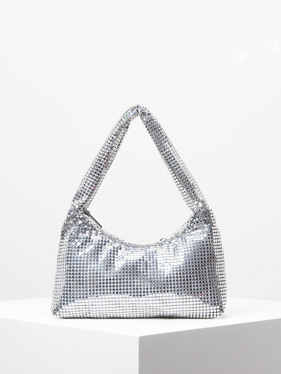 Elevate your formal ensemble with our Shimmering Rhinestone Clutch - the perfect accessory for any evening event. Its sparkling rhinestone design exudes elegance and adds a touch of glamour to your outfit. Its compact size makes it ideal for carrying your essentials, while its sleek design is sure to make a statement. Elevate your style game with this must-have clutch.