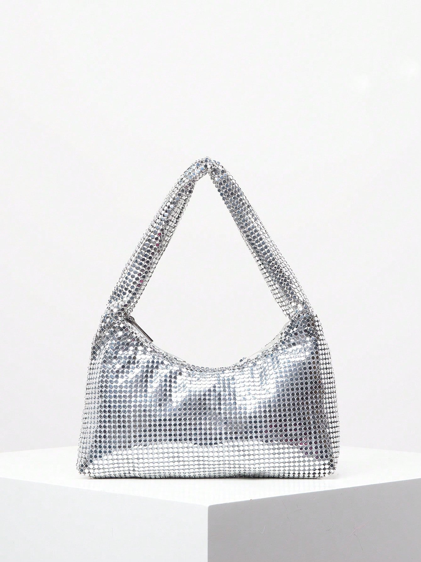 Elevate your formal ensemble with our Shimmering Rhinestone Clutch - the perfect accessory for any evening event. Its sparkling rhinestone design exudes elegance and adds a touch of glamour to your outfit. Its compact size makes it ideal for carrying your essentials, while its sleek design is sure to make a statement. Elevate your style game with this must-have clutch.