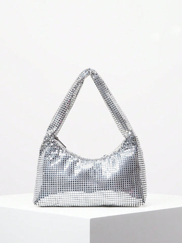 Elevate your formal ensemble with our Shimmering Rhinestone Clutch - the perfect accessory for any evening event. Its sparkling rhinestone design exudes elegance and adds a touch of glamour to your outfit. Its compact size makes it ideal for carrying your essentials, while its sleek design is sure to make a statement. Elevate your style game with this must-have clutch.