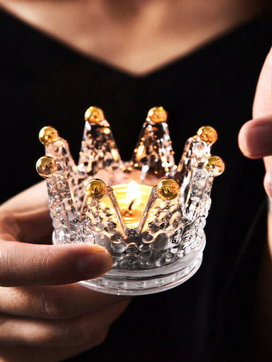 Add a touch of elegance to your home decor with the Regal Crystal Crown Candle Holder in Gold. Made of high-quality crystal, this candle holder exudes luxury and sophistication. The intricate crown design adds a regal touch, while the gold color complements any room. Perfect for adding a warm glow to your space and impressing your guests.