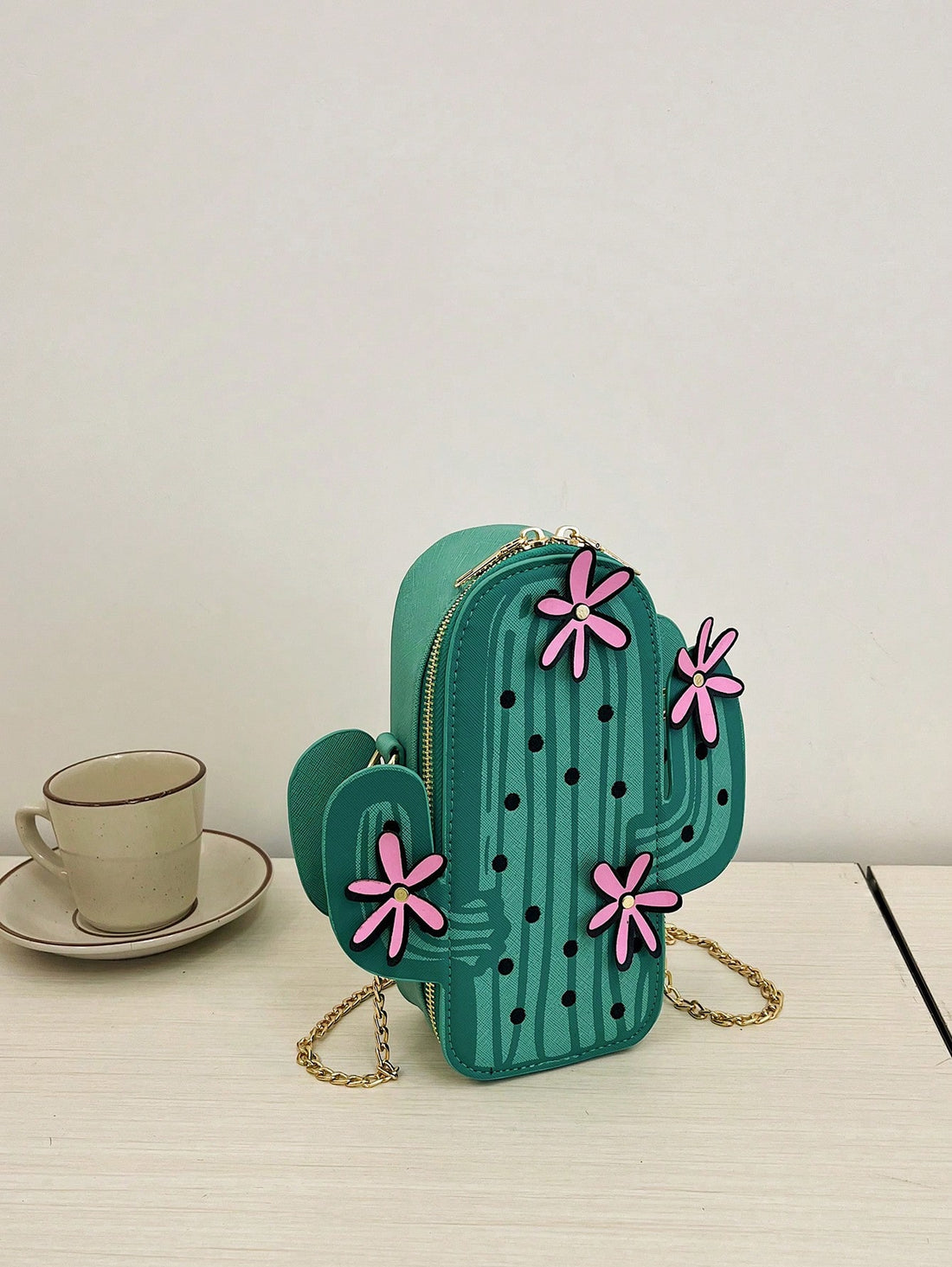 Introducing Prickly Chic, the ultimate cactus shoulder bag for stylish commuting women. With its unique design and durable material, this bag is perfect for everyday use. Stay organized with multiple pockets and compartments, while making a statement with its trendy cactus print. Elevate your daily commute with Prickly Chic.