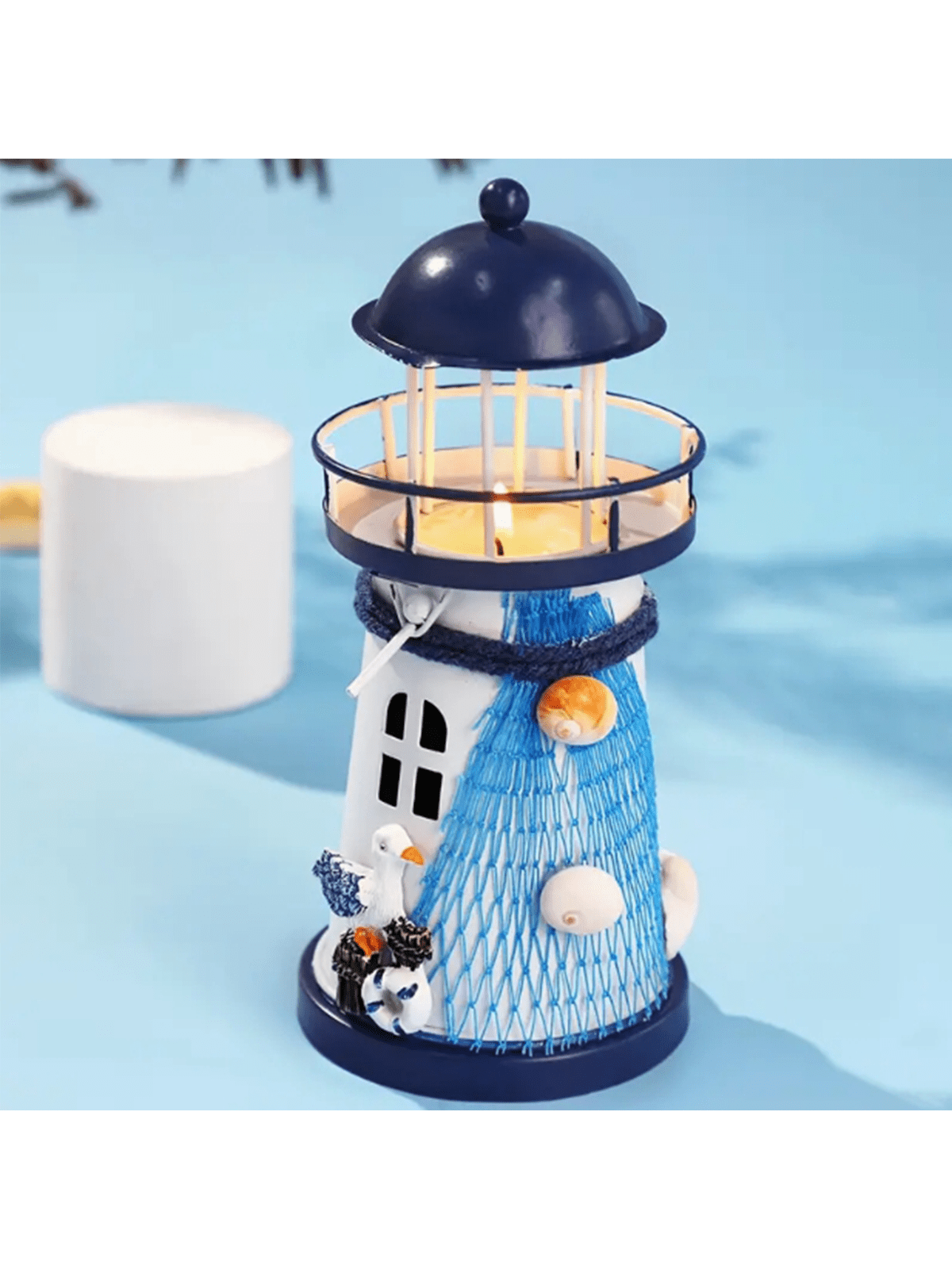 Introduce a soothing ambiance to your home with our Seaside Serenity Lighthouse Candlestick Decoration. Crafted from high-quality materials, this candlestick exudes a coastal charm and is the perfect addition to any beach-inspired décor. Light up your space and enjoy the peaceful glow of our lighthouse design.