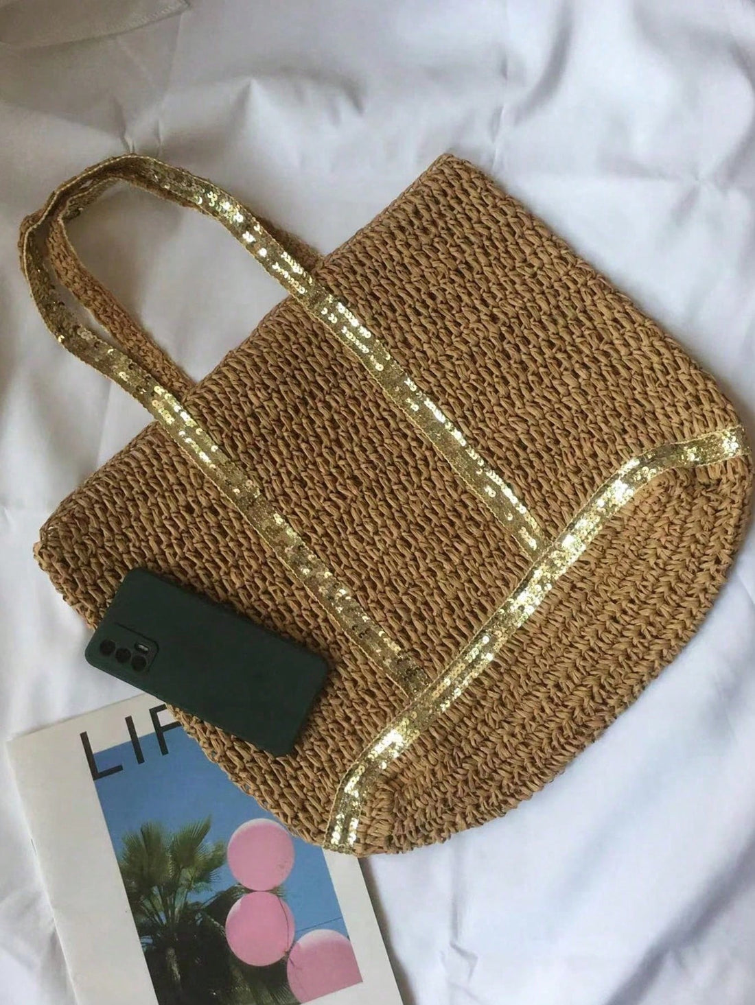 Introducing your ultimate vacation companion, the Summer Chic Tassel Tote Bag. With its stylish design and tassel details, this bag is not only a fashion statement but also a functional accessory. Made with high-quality materials, it is durable and spacious enough for all your travel essentials. Don't sacrifice style for practicality, get the Summer Chic Tassel Tote Bag now.
