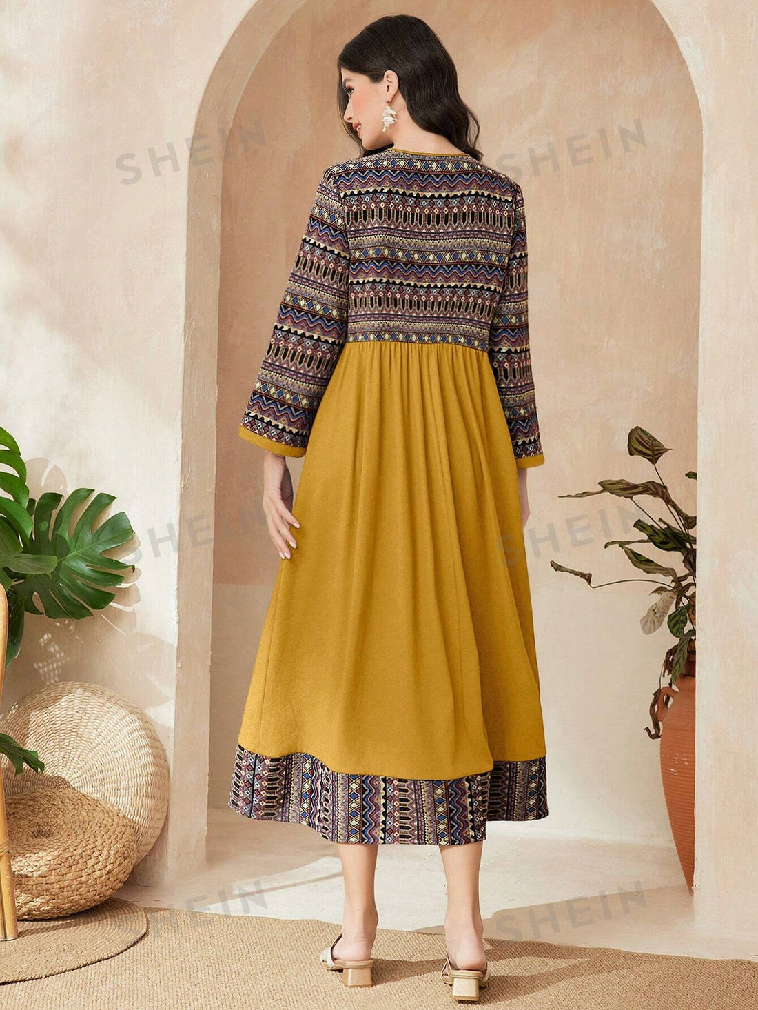 This stylish Spring Fling dress features a flattering notched v-neck design and a unique printed pattern, perfect for adding a touch of sophistication to your daily wardrobe. Made with comfortable materials, this dress is both fashionable and functional, making it a must-have for any fashion-forward woman.