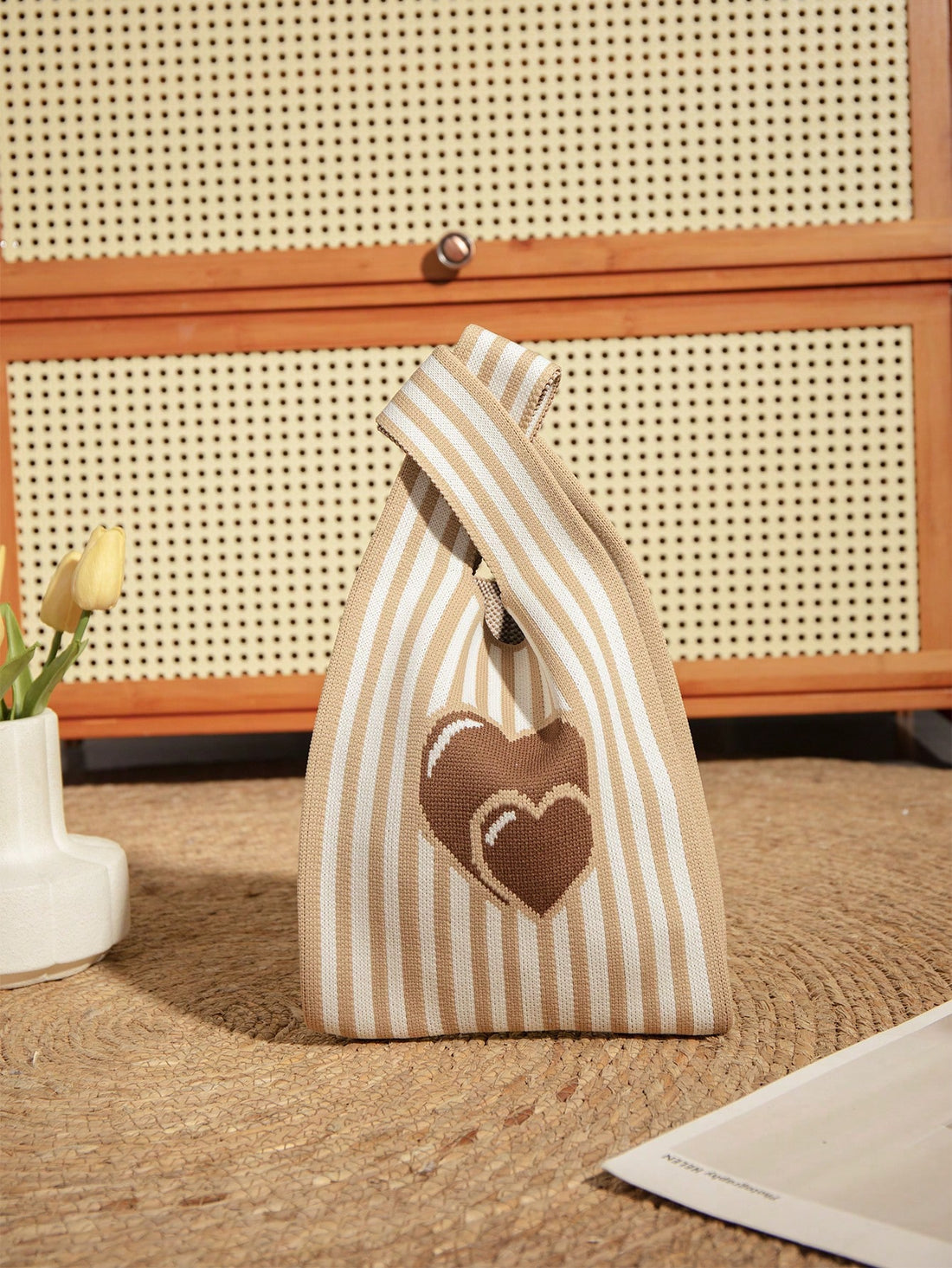 Elevate your style game with this chic and practical Mini Brown Heart Balloon Handbag. Made for your daily adventures, this handbag features a playful heart balloon design and is just the right size to carry all your essentials. Its sturdy construction ensures durability, making it a must-have for any fashion-forward individual.