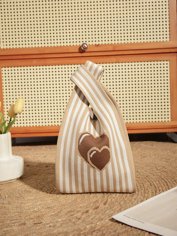 Elevate your style game with this chic and practical Mini Brown Heart Balloon Handbag. Made for your daily adventures, this handbag features a playful heart balloon design and is just the right size to carry all your essentials. Its sturdy construction ensures durability, making it a must-have for any fashion-forward individual.