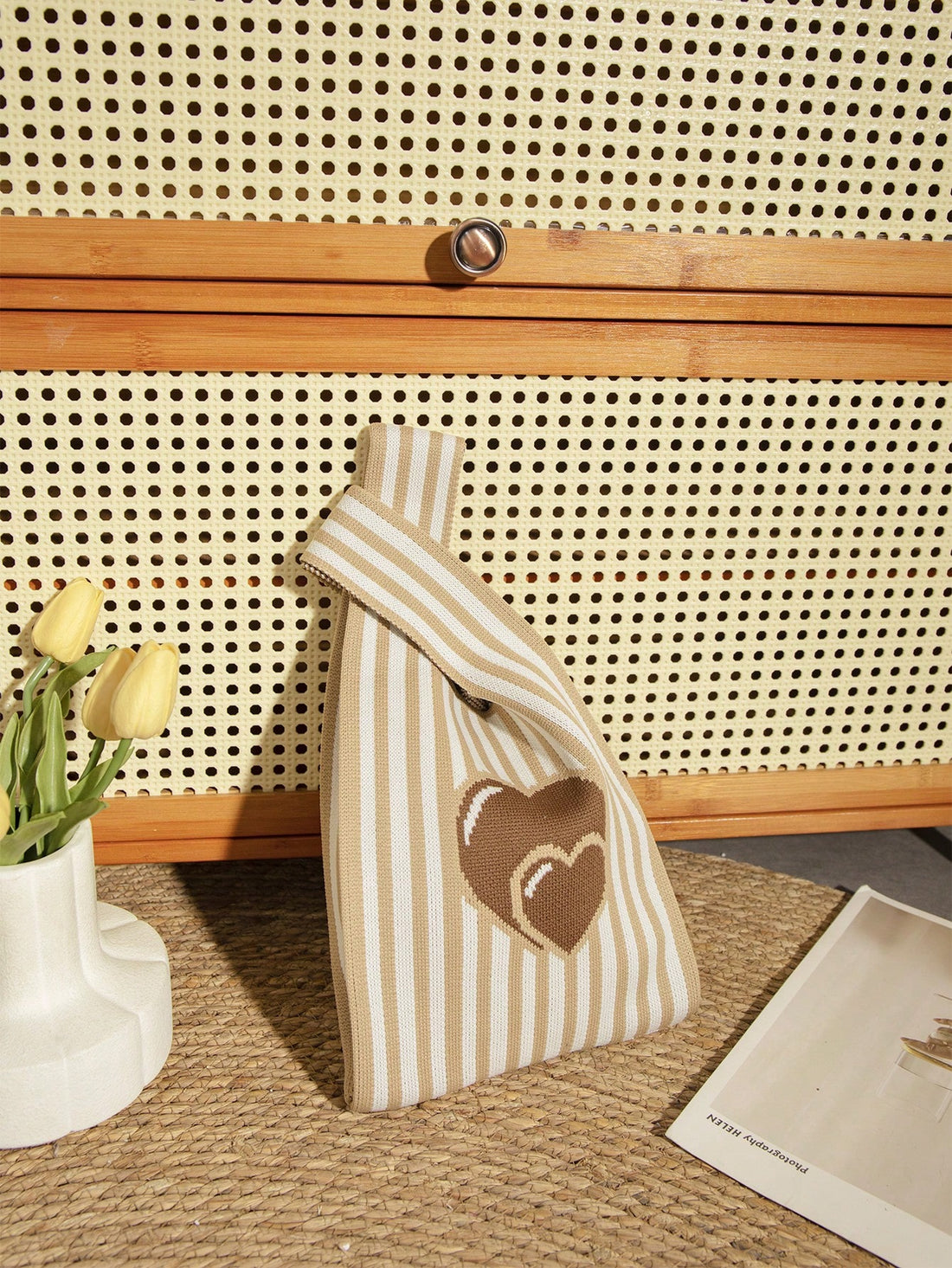 Elevate your style game with this chic and practical Mini Brown Heart Balloon Handbag. Made for your daily adventures, this handbag features a playful heart balloon design and is just the right size to carry all your essentials. Its sturdy construction ensures durability, making it a must-have for any fashion-forward individual.