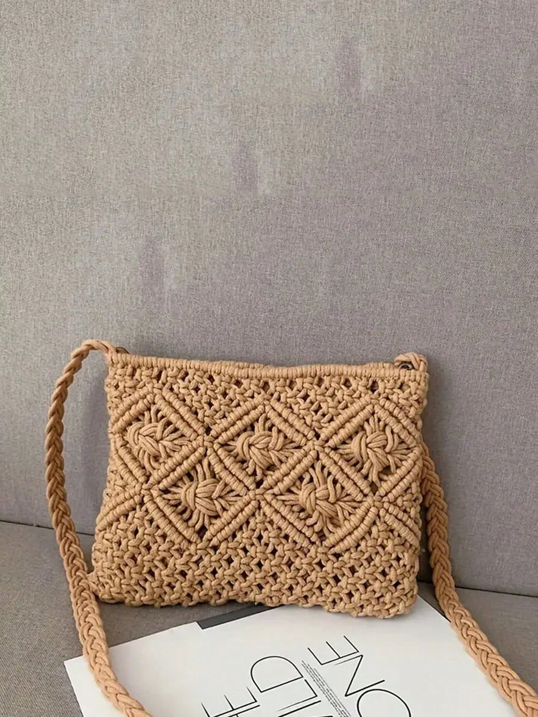 This stylish woven crossbody bag is perfect for your next vacation or casual outing. With its versatile design, it can easily transition from day to night. Its spacious interior and durable construction make it a must-have for your travels. Say goodbye to bulky bags and hello to effortless style.