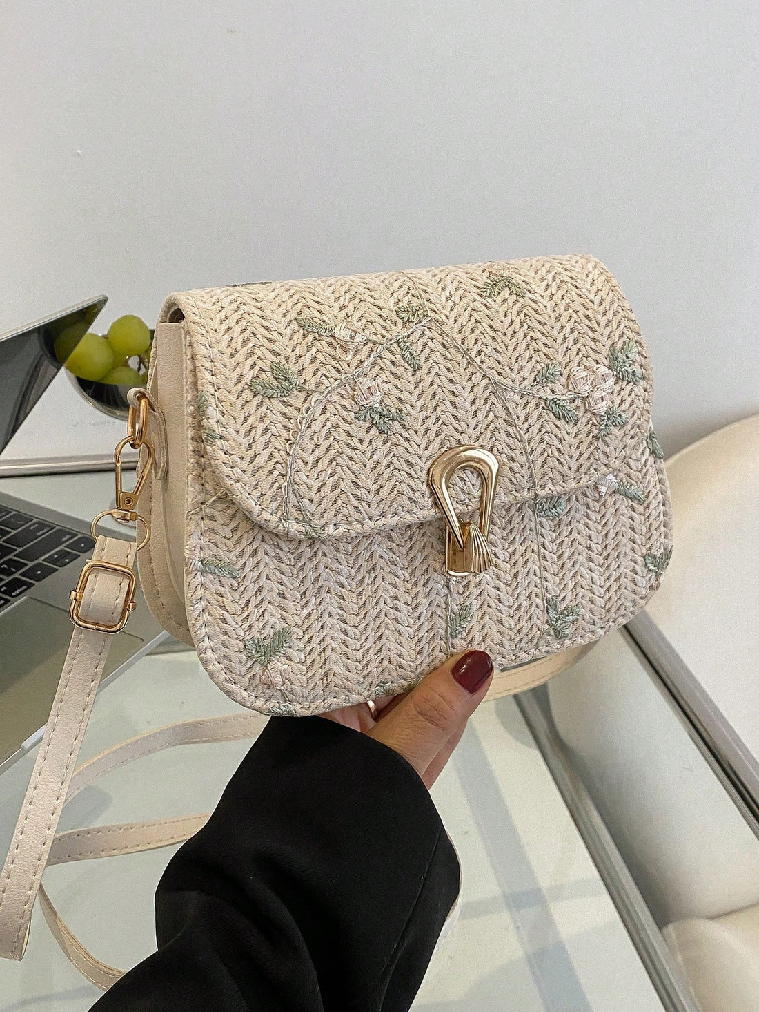 This Spring &amp; Summer Grass Braided Bag is a must-have accessory for any fashion-forward individual. The intricate lace flower design adds a touch of elegance to the trendy single shoulder saddle bag style. Made with durable grass materials, this bag is perfect for the warmer seasons. Upgrade your wardrobe with this fashionable and functional bag.