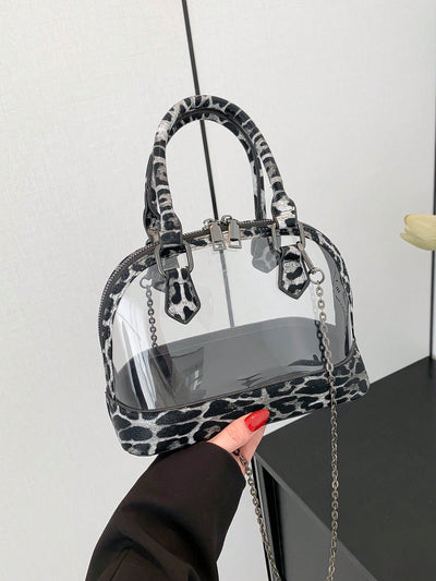 Introducing Leopard Chic, the perfect handbag for the modern woman. Made with transparent PU material, this stylish purse is ideal for all your shopping, dating, and commuting needs. Stay on trend while showcasing your fashion-forward style. Practical and chic, it's a must-have accessory for any fashionista.