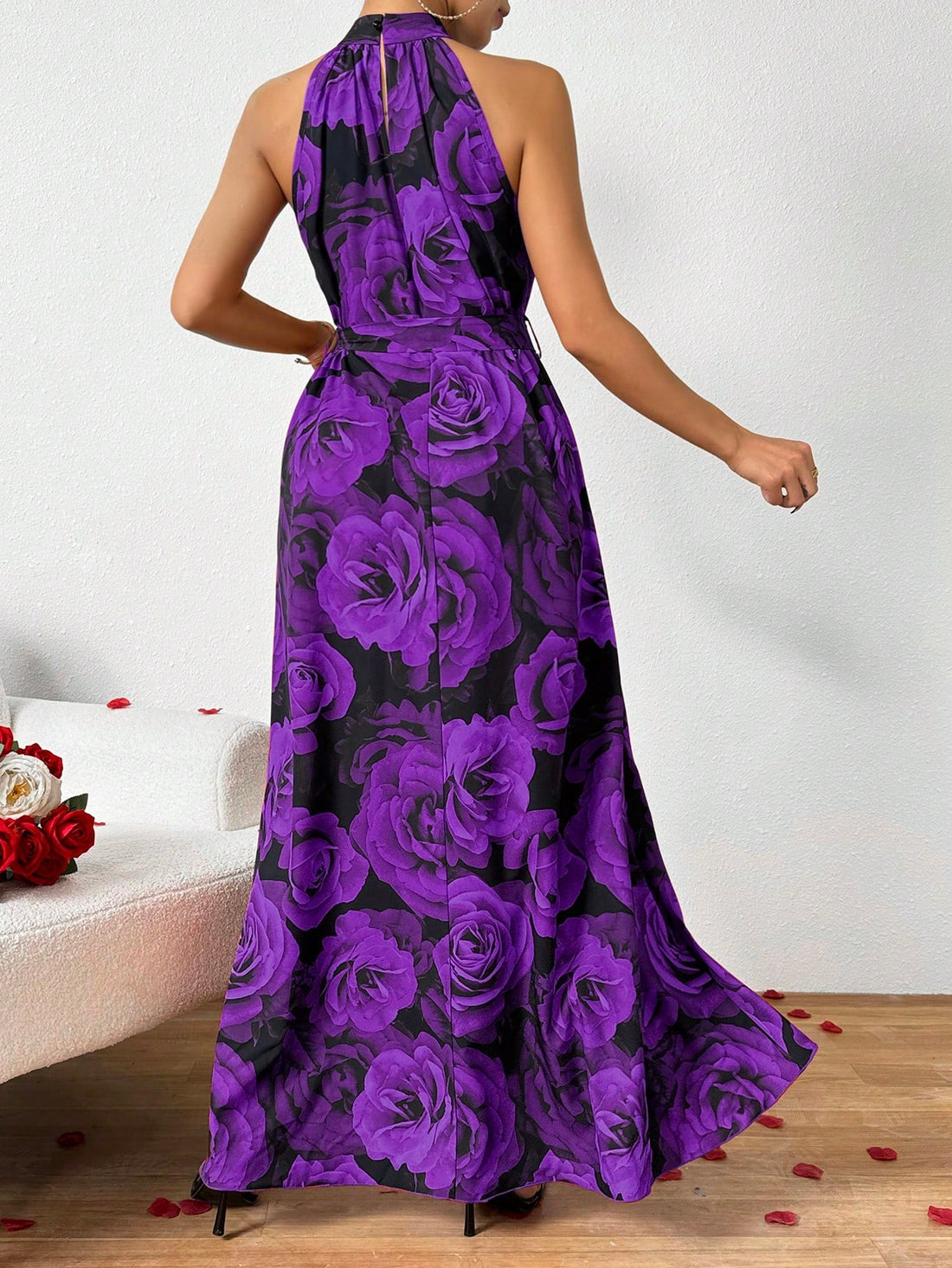 This Pretty in Print dress features a summer-inspired large rose print design and a halter neckline, making it the perfect choice for your summer wardrobe. Its sleeveless and long silhouette offers a stylish and comfortable fit. Embrace the warmer days in this beautiful and versatile dress.