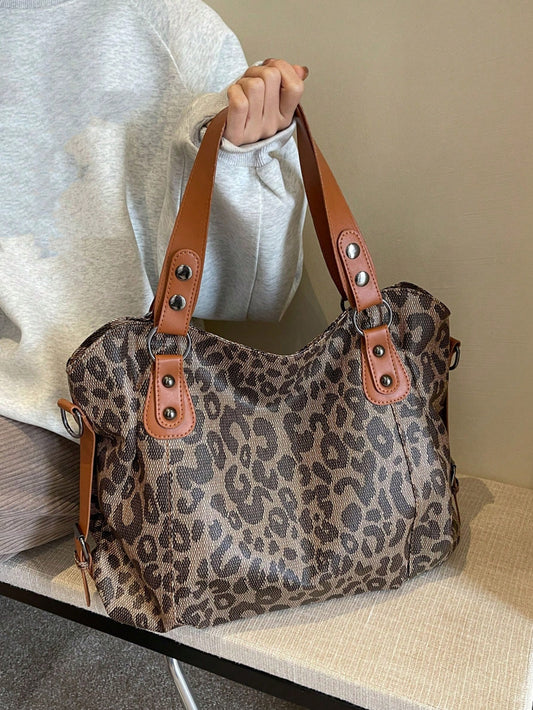 This Leopard Design Print Retro Style Tote Bag features a bold and trendy leopard print, perfect for making a statement. With a spacious interior, this bag can hold all your daily essentials and more. Its Korean crossbody design adds a touch of modernity to its retro style. Expertly crafted for both fashion and function.