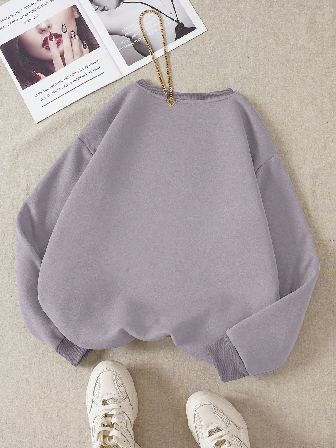 Stay warm and stylish with our Sweetheart Sweater! This cozy long sleeve drop shoulder sweatshirt features a cute heart print, perfect for any casual look. Made from premium materials, it'll keep you comfortable all day long. Upgrade your wardrobe with this must-have piece!