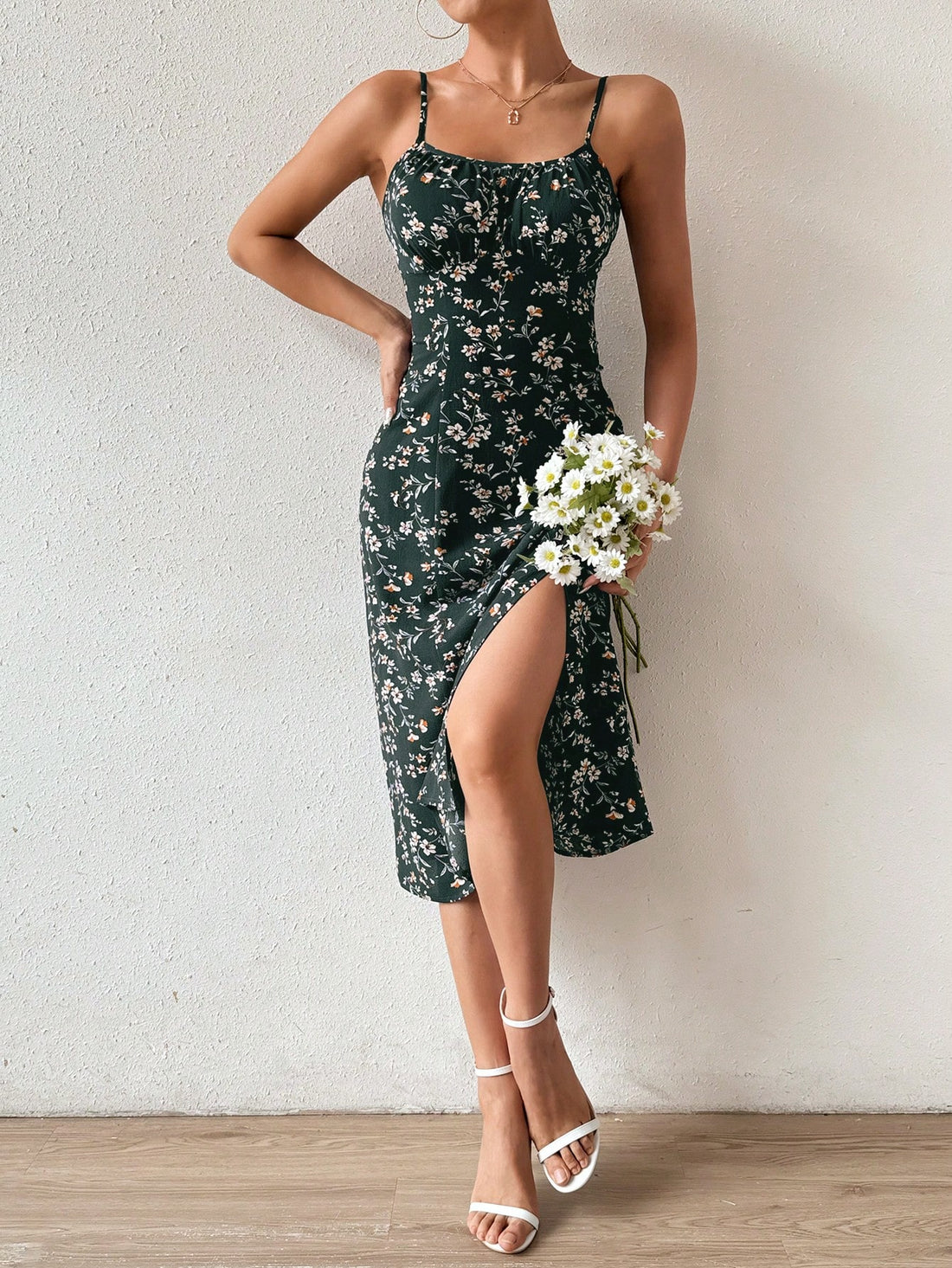 This Floral Essence dress features a delicate, feminine design with spaghetti straps and a stylish slit hem. Its floral pattern adds a touch of elegance to any occasion. Made with high-quality materials, it offers both comfort and style, making it a must-have for any fashion-forward individual.