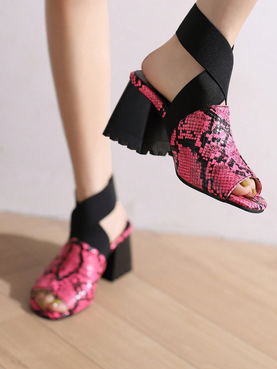 Elevate your style with our Stylish Snake Patterned Peep Toe High Heeled Sandals in Pink. These sandals feature a trendy snake print design, a chic peep toe, and a high heel. Perfect for any occasion, they will add a touch of sophistication to any outfit.