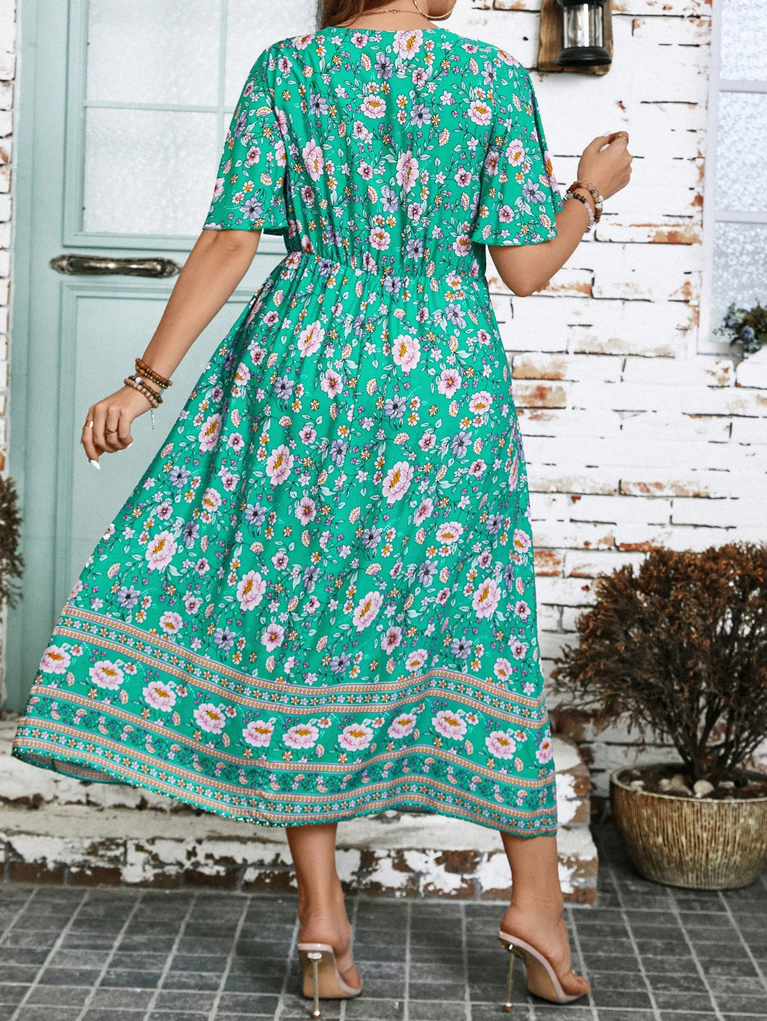 Get ready to turn heads in our Effortless Elegance dress! Featuring a playful floral print, flattering V-neck, and flirty ruffle hem, this plus size dress is perfect for summer. Bring on the compliments!
