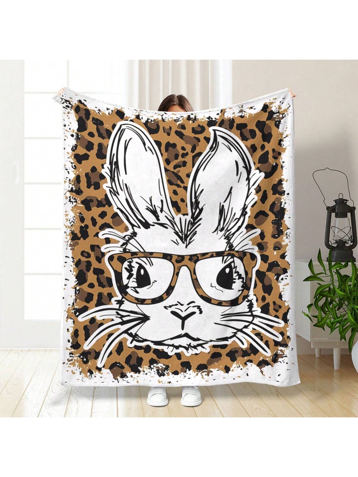 Experience ultimate comfort and versatility with our Cozy Cartoon Leopard Print White Rabbit <a href="https://canaryhouze.com/collections/blanket?sort_by=created-descending" target="_blank" rel="noopener">Blanket</a>. Made from soft material, it is perfect for use at home or when traveling. The playful leopard print adds a touch of style to its functionality.