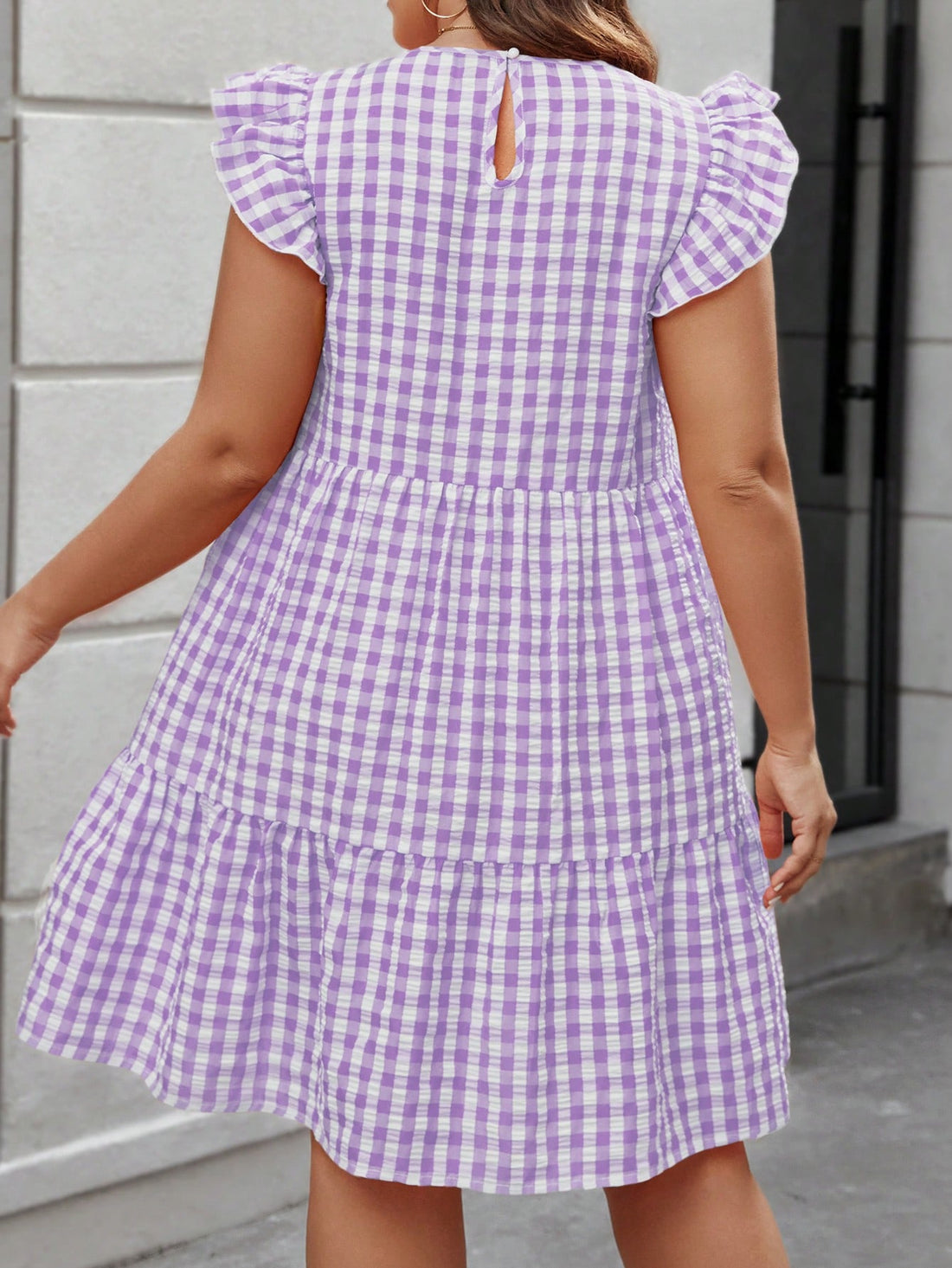 Elevate your summer wardrobe with our Chic Plus Size Gingham Flare Sleeve Dress. Designed with a flattering round neck and trendy flare sleeves, this dress is perfect for any occasion. Made from soft and comfortable fabric, it will keep you looking and feeling stylish all season long.
